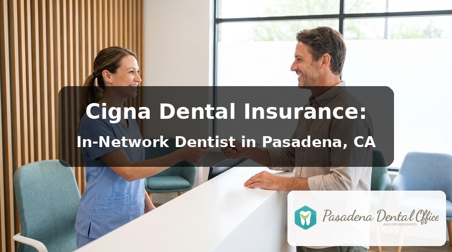 Front desk team member handing an insurance card back to a smiling patient at Pasadena Dental Office and Orthodontics, a Cigna in-network dentist in Pasadena, CA
