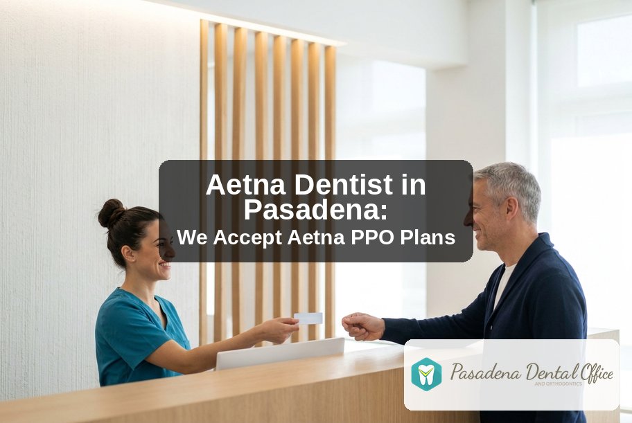 Pasadena Dental Office and Orthodontics front desk team member handing back an insurance card to a patient, Aetna dentist in Pasadena, CA